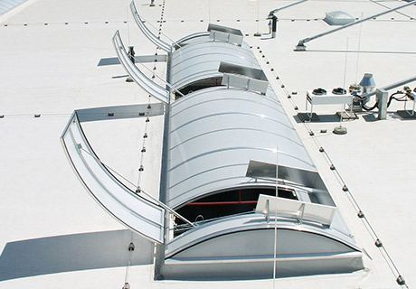 Vario continuous rooflight with smoke ventilation flaps and wind deflectors