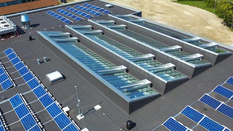 VELUX Glazing Panel smoke venting panels as triple glazing mono pitched with wind deflectors.