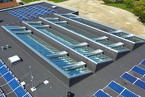 VELUX Glazing Panel smoke venting panels as triple glazing mono pitched with wind deflectors.