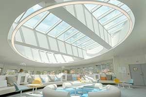 VELUX modular skylight solution with Atrium Longlight and shaped, oval lining. Somfy Lighthouse, France